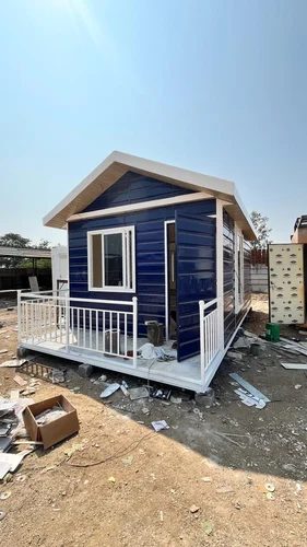 Prefabricated Portable Farmhouse - Blue White Cabin with Porch and Railing Gujarat